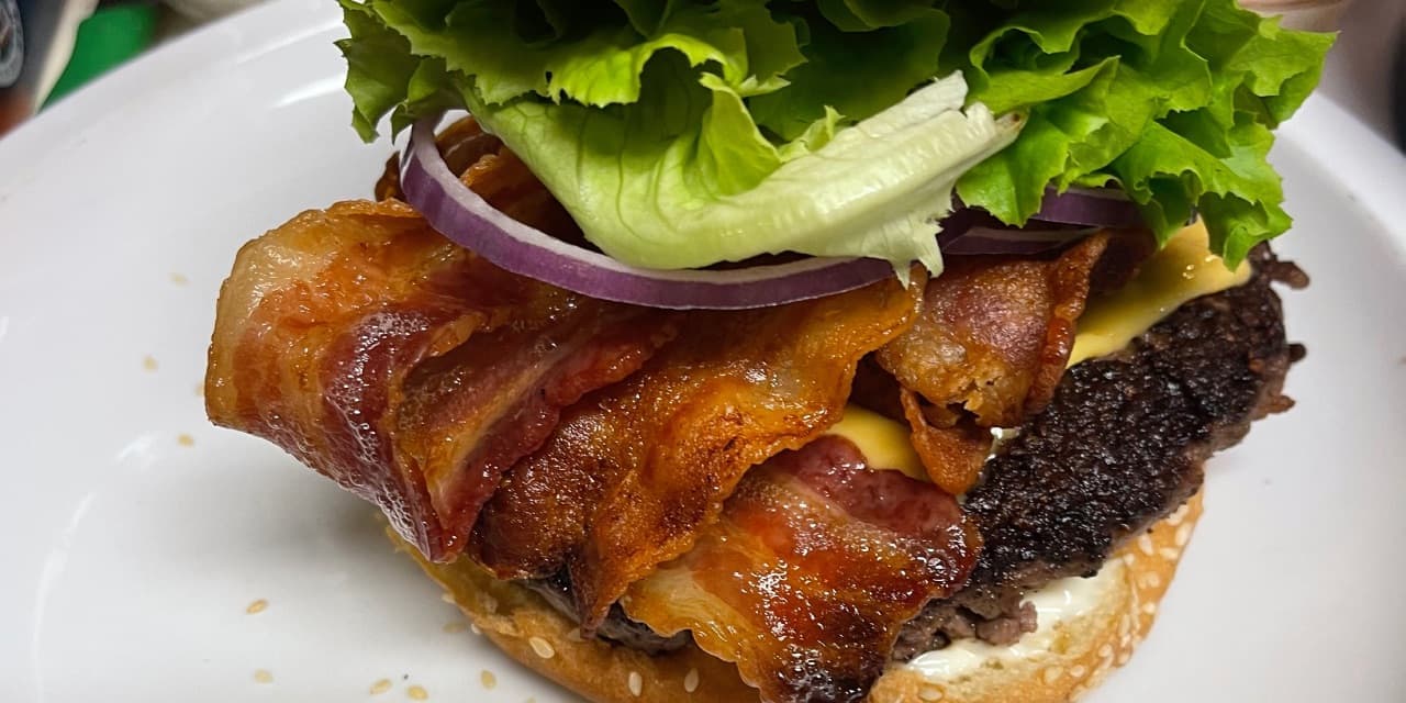 Bacon cheeseburger cooked in cast iron