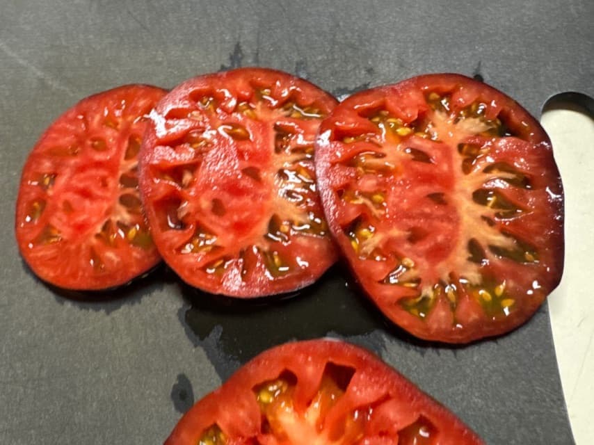 Heirloom tomatoes sliced on Epicurean cutting board